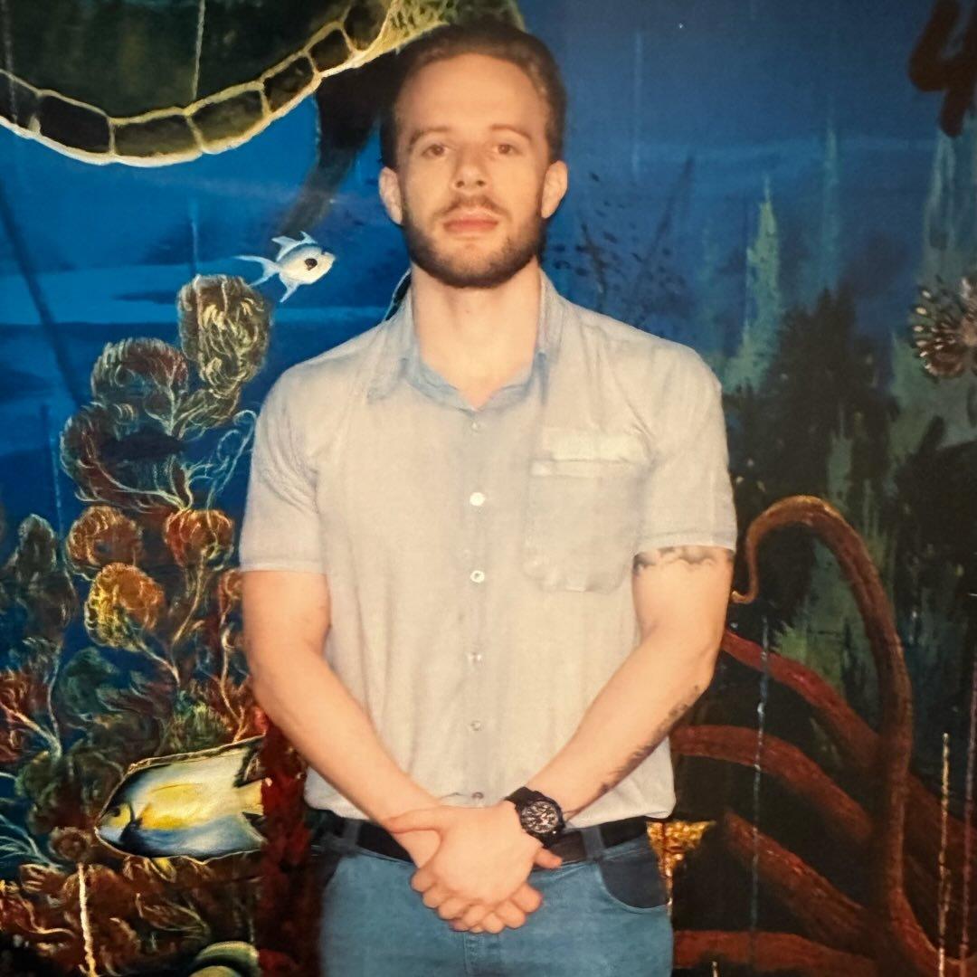 Aaron at the aquarium mural
